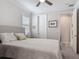 Bedroom with a comfortable bed, soft carpet, a ceiling fan, and a doorway at 425 Wedgeworth Ln, Deland, FL 32724