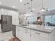 Bright kitchen with a center island, stainless steel appliances, and an open layout at 425 Wedgeworth Ln, Deland, FL 32724