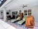Covered lanai featuring lounge chairs, seating areas, and view of the pool and interior at 425 Wedgeworth Ln, Deland, FL 32724