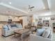 Spacious open-concept living area flows to the kitchen with a seamless design and lots of seating at 425 Wedgeworth Ln, Deland, FL 32724