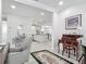 Bright room showcasing hardwood floors and an open floorplan to the kitchen and living area at 425 Wedgeworth Ln, Deland, FL 32724