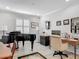 Home office showcasing hardwood floors, plantation shutters, and classic decor at 425 Wedgeworth Ln, Deland, FL 32724
