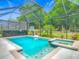 Beautiful screened-in pool and hot tub, perfect for relaxation and recreation in a private setting at 425 Wedgeworth Ln, Deland, FL 32724