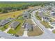 An aerial view of a suburban neighborhood featuring homes with solar panels and fenced yards in a community setting at 4273 Ne 29Th Pl, Ocala, FL 34470
