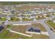 Aerial view of residential neighborhood showcasing the layout of houses with solar panels at 4273 Ne 29Th Pl, Ocala, FL 34470