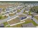 Scenic aerial shot showcases the layout of the community with many homes having solar panels at 4273 Ne 29Th Pl, Ocala, FL 34470