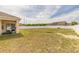 Spacious backyard offering privacy with a white fence and room for outdoor activities at 4273 Ne 29Th Pl, Ocala, FL 34470