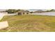 Generous backyard space enclosed by a white fence, providing privacy and space for outdoor activities at 4273 Ne 29Th Pl, Ocala, FL 34470