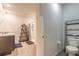 Neutral bathroom with a shower, storage shelving, and modern fixtures at 4273 Ne 29Th Pl, Ocala, FL 34470