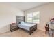Bedroom with natural light, a cozy bed, and coordinated nightstand, perfect for a restful retreat at 4273 Ne 29Th Pl, Ocala, FL 34470