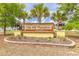 Elegant community entrance sign for Oak Hill Plantation, surrounded by lush landscaping at 4273 Ne 29Th Pl, Ocala, FL 34470
