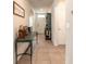 Inviting foyer with tiled floors, vintage decor, and a view into the home's layout at 4273 Ne 29Th Pl, Ocala, FL 34470