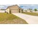Inviting home featuring a two-car garage, situated on a large lot with a well-kept lawn at 4273 Ne 29Th Pl, Ocala, FL 34470