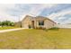 Attractive one-story home with a two-car garage and a manicured front lawn in a residential neighborhood at 4273 Ne 29Th Pl, Ocala, FL 34470