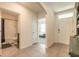 Hallway with tiled flooring, leading to a bathroom and bedroom at 4273 Ne 29Th Pl, Ocala, FL 34470