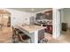 Kitchen island with barstool seating, stainless steel appliances, and black cabinets at 4273 Ne 29Th Pl, Ocala, FL 34470