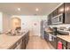 Kitchen featuring stainless steel appliances, tile flooring, and an open concept layout at 4273 Ne 29Th Pl, Ocala, FL 34470