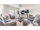 Comfortable living room with plush seating, a ceiling fan, and ample space for relaxation at 4273 Ne 29Th Pl, Ocala, FL 34470