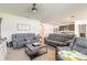 Open concept living room with sofas, a coffee table with a chessboard, and an open floor plan at 4273 Ne 29Th Pl, Ocala, FL 34470