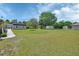 Expansive backyard featuring a large grassy area with sheds, offering ample space for outdoor activities at 430 S Woodward Ave, Deland, FL 32720