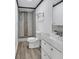 Modern bathroom featuring updated fixtures, tiled shower, and vanity at 430 S Woodward Ave, Deland, FL 32720