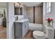 Well-lit bathroom with updated vanity, bathtub, and tiled walls at 430 S Woodward Ave, Deland, FL 32720
