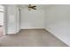 A serene bedroom features neutral carpet, a ceiling fan, and ample natural light at 430 S Woodward Ave, Deland, FL 32720