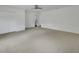 A spacious carpeted bedroom with an attached bathroom and closet at 430 S Woodward Ave, Deland, FL 32720