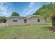 Charming home exterior with solar panels and a lush green lawn at 430 S Woodward Ave, Deland, FL 32720