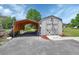 Spacious shed with a covered carport, offering ample storage and parking solutions at 430 S Woodward Ave, Deland, FL 32720