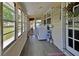 Bright sunroom featuring a washer and dryer at 430 S Woodward Ave, Deland, FL 32720