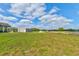 A portion of the large lot featuring a metal storage shed is visible in the backyard at 4503 Colony Rd, New Smyrna Beach, FL 32168