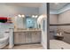 Modern bathroom featuring a walk-in shower, granite countertops, wooden cabinets, and coordinated decor at 4503 Colony Rd, New Smyrna Beach, FL 32168