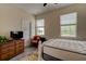 Bedroom with natural light, dresser, and decor chair at 4503 Colony Rd, New Smyrna Beach, FL 32168