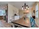 An open-concept dining room features a large wooden table and stylish furnishings at 4503 Colony Rd, New Smyrna Beach, FL 32168