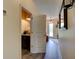 Bright hallway with an open doorway to the powder room at 4503 Colony Rd, New Smyrna Beach, FL 32168