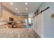 Kitchen features granite countertops, stainless appliances, and a sliding barn door at 4503 Colony Rd, New Smyrna Beach, FL 32168