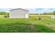 Backyard includes outbuilding and additional storage shed at 4503 Colony Rd, New Smyrna Beach, FL 32168