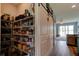 Spacious walk-in pantry featuring a sliding barn door entrance and plenty of shelving for storage at 4503 Colony Rd, New Smyrna Beach, FL 32168
