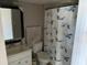 A well-lit bathroom featuring a vanity, toilet, and shower with a stylish curtain at 4555 Tower Pine Rd # Ge, Orlando, FL 32839