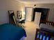 Large bedroom with two beds, a desk, and ample floor space at 4555 Tower Pine Rd # Ge, Orlando, FL 32839