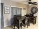 The dining area features a modern table set, providing an inviting place for meals at 4555 Tower Pine Rd # Ge, Orlando, FL 32839
