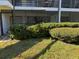 Apartment exterior featuring a patio and a view of the surrounding landscape at 4555 Tower Pine Rd # Ge, Orlando, FL 32839