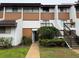 Inviting two-story townhomes featuring a well-maintained landscape, private entrances, and a clean, modern facade at 4555 Tower Pine Rd # Ge, Orlando, FL 32839