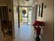 Bright foyer features tile flooring, security door, and seasonal decor, offering a welcoming entrance at 4555 Tower Pine Rd # Ge, Orlando, FL 32839