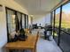 A spacious patio with a dining table and grill overlooking lush greenery at 4555 Tower Pine Rd # Ge, Orlando, FL 32839