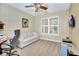 A comfortable bedroom shows natural light from the window and a ceiling fan at 4670 Links Village Dr # B102, Ponce Inlet, FL 32127