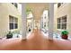 Beautiful exterior courtyard with landscaped garden and decorative columns at 4670 Links Village Dr # B102, Ponce Inlet, FL 32127