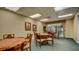 Bright game room with round tables, comfortable chairs, and a window view at 4670 Links Village Dr # B102, Ponce Inlet, FL 32127