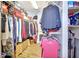 Spacious walk-in closet with shelving and ample storage for clothes and other items at 4670 Links Village Dr # B102, Ponce Inlet, FL 32127